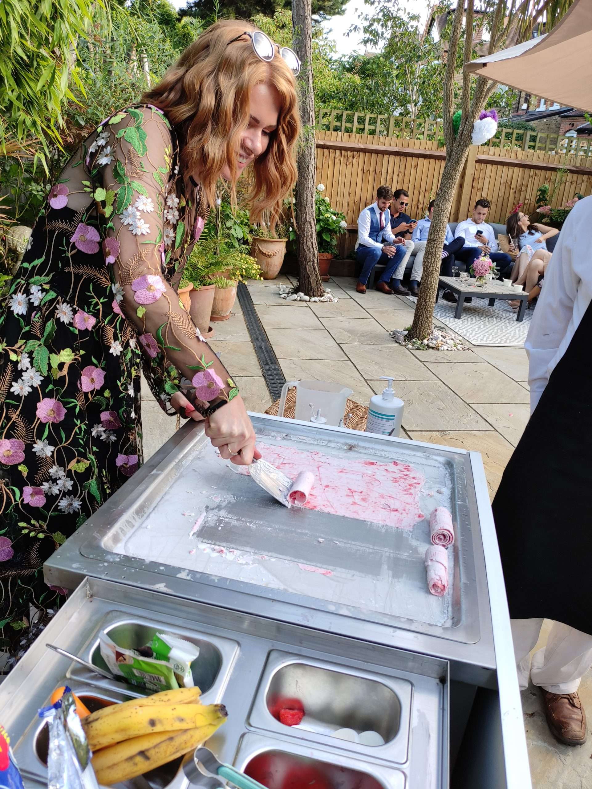 A wedding guest making strawberry and Meringue ice cream rolls