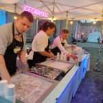 3 Rolled ice cream crafters making ice cream rolls at Cambridge May Ball