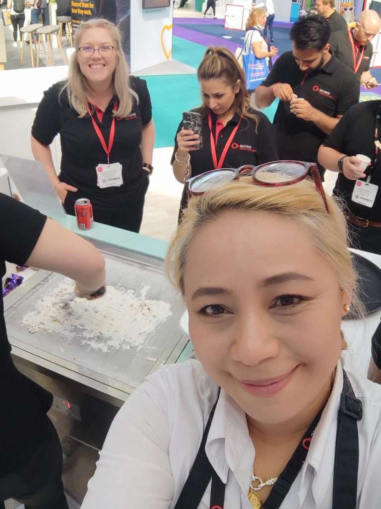 People making ice cream rolls at an exhibition in London Olympia