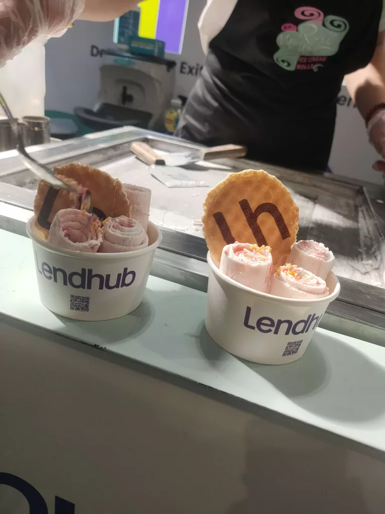strawberry and meringue ice cream rolls with branded wafers and cups at a Finance Exhibition