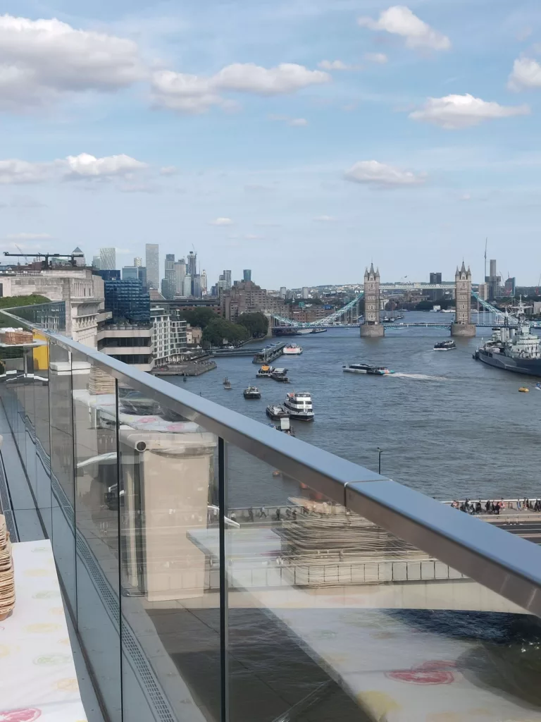 view of tower bridge London at a roof top party with roll me up