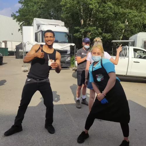 cast enjoy ice cream rolls on film set
