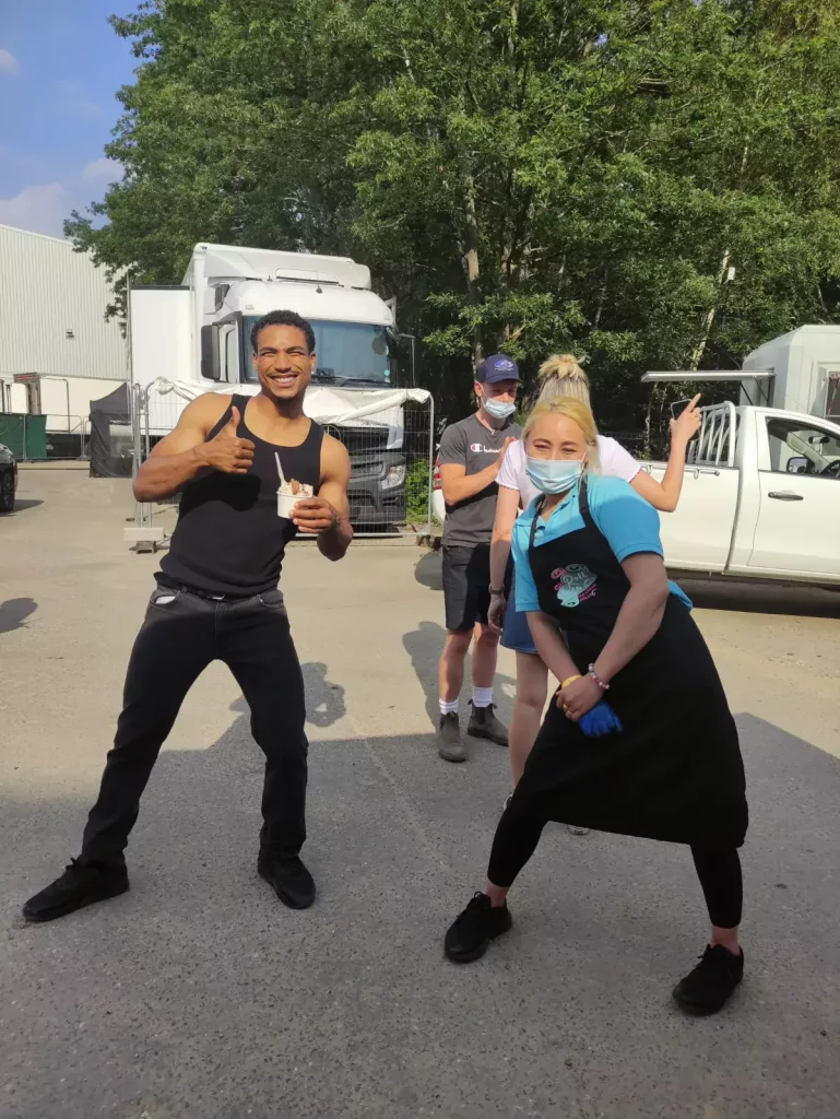 cast enjoy ice cream rolls on film set